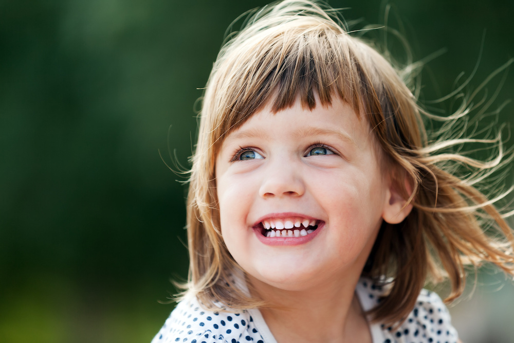 Smiling child with baby teeth representing paediatric dentistry