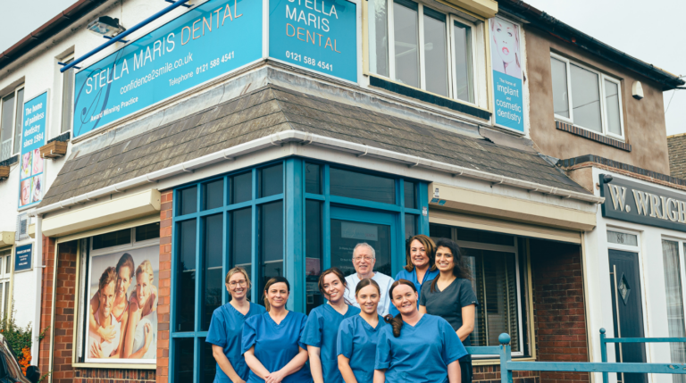 Group of Stella Maris dental team stood outside the practice