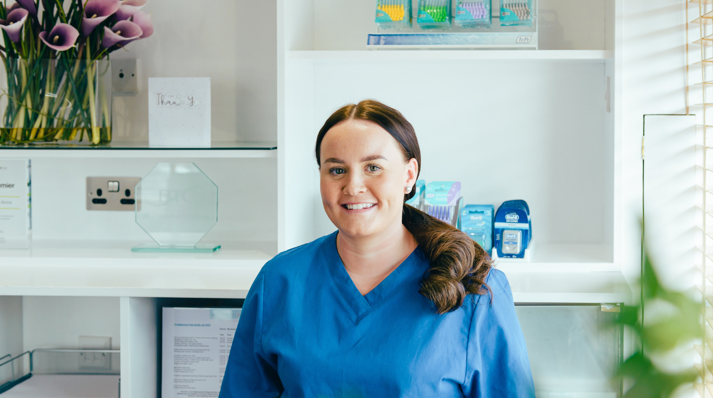 One of Stella's registered nurses, Ellie, sat at the reception desk